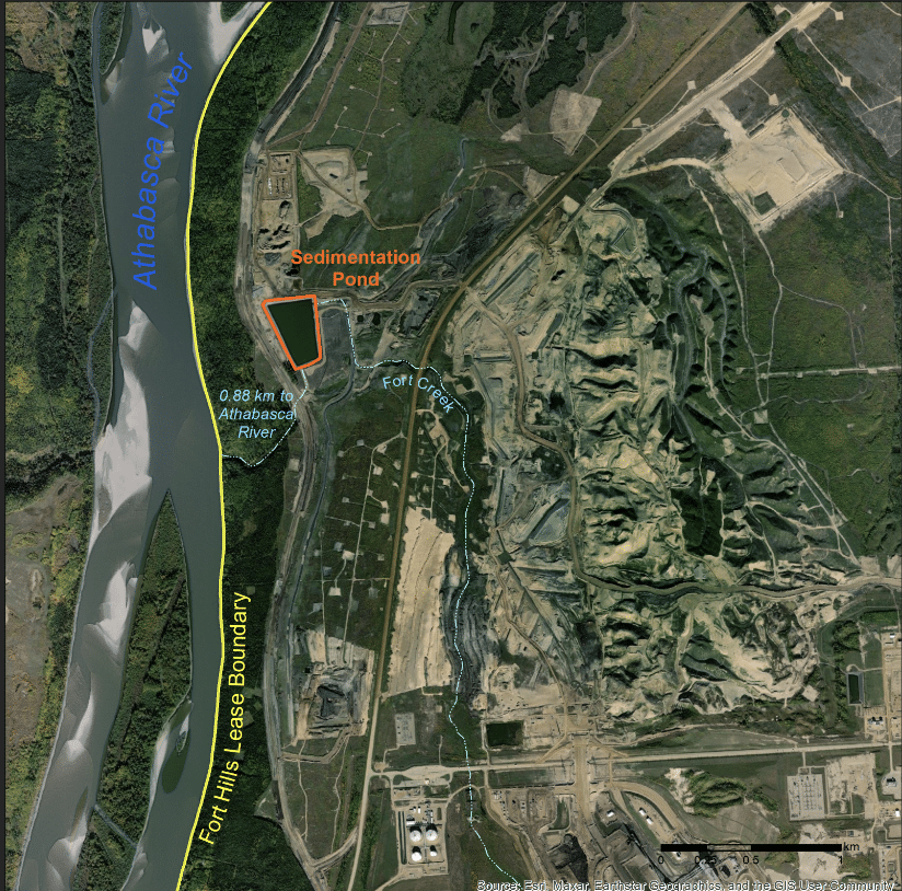 Figure 1: Map of the impacted area from 2022, including sedimentation pond, which drains into Fort Creek and lies less than a kilometer away from the Athabasca River. Note the path of the Fort Creek has been diverted to collect discharge from the sedimentation pond. Satellite image from 26 September 2022.